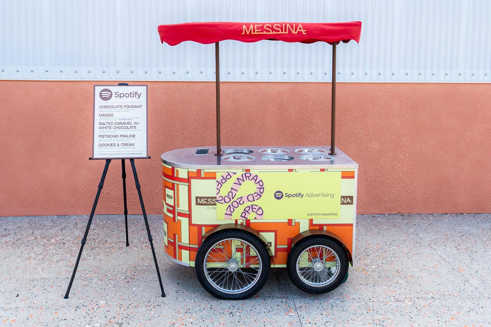 Cart No.1 with a Spotify panel on its side and a flavour menu on an easel
