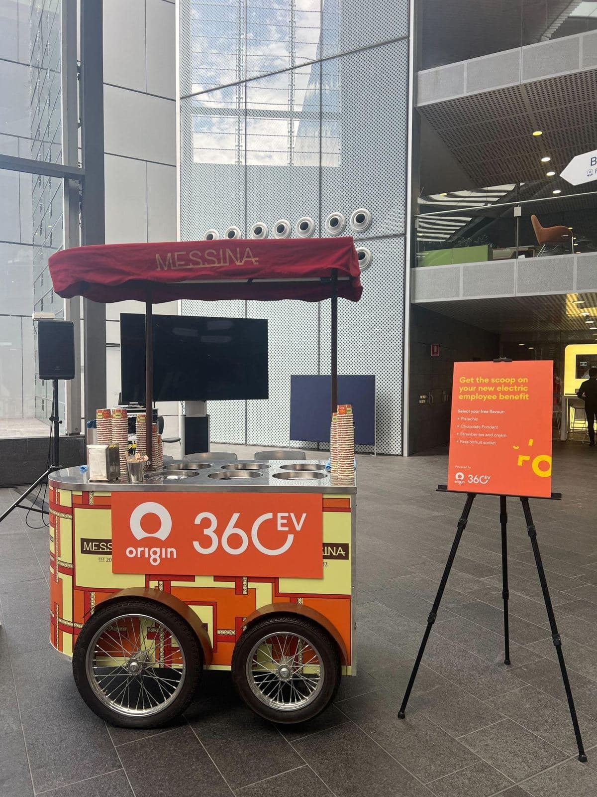 Cart No.1 with an orange branded panel and a matching sign