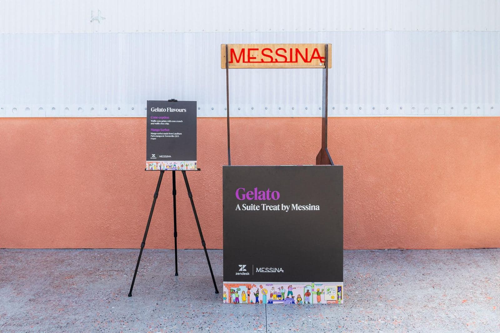 Small gelato stand with a black branded panel and a printed flavour menu